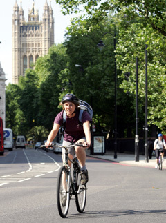 A woman Cycling on the road in London