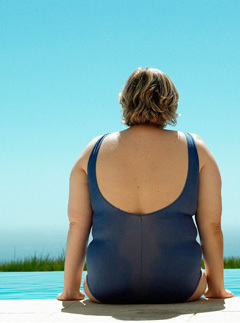 Curvaceous woman at swimming pool