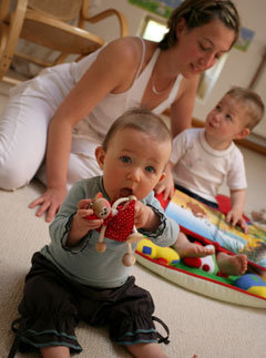Single mother playing with children