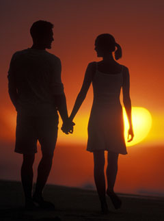 Couple walking along the beach