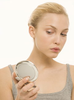 Woman looking in the mirror