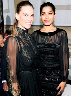Hilary Swank and Freida Pinto at the Salvatore Ferragamo Cruise Collection fashion show in Paris