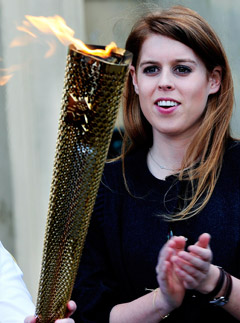 Princess Beatrice greets the Olympic Torch at Harewood House in Leeds