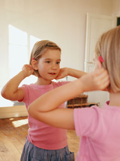 Girl-looking-in-mirror