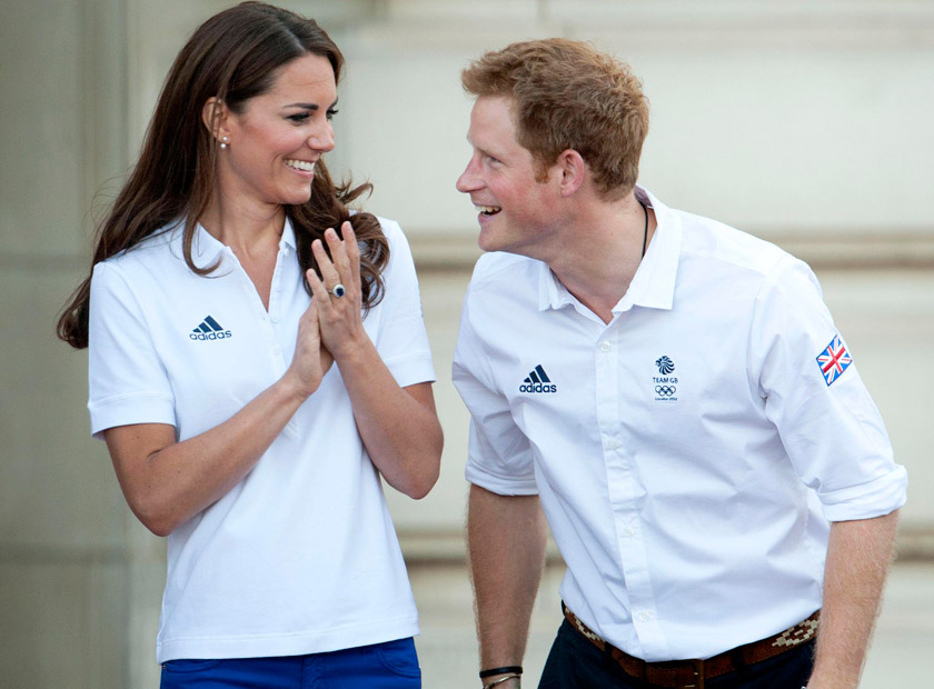 Prince William, Kate Middleton and Prince Harry welcome the Olympic torch to Buckingham Palace