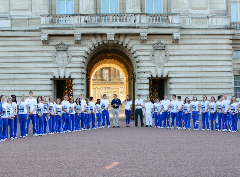 Prince William, Kate Middleton and Prince Harry welcome the Olympic torch to Buckingham Palace