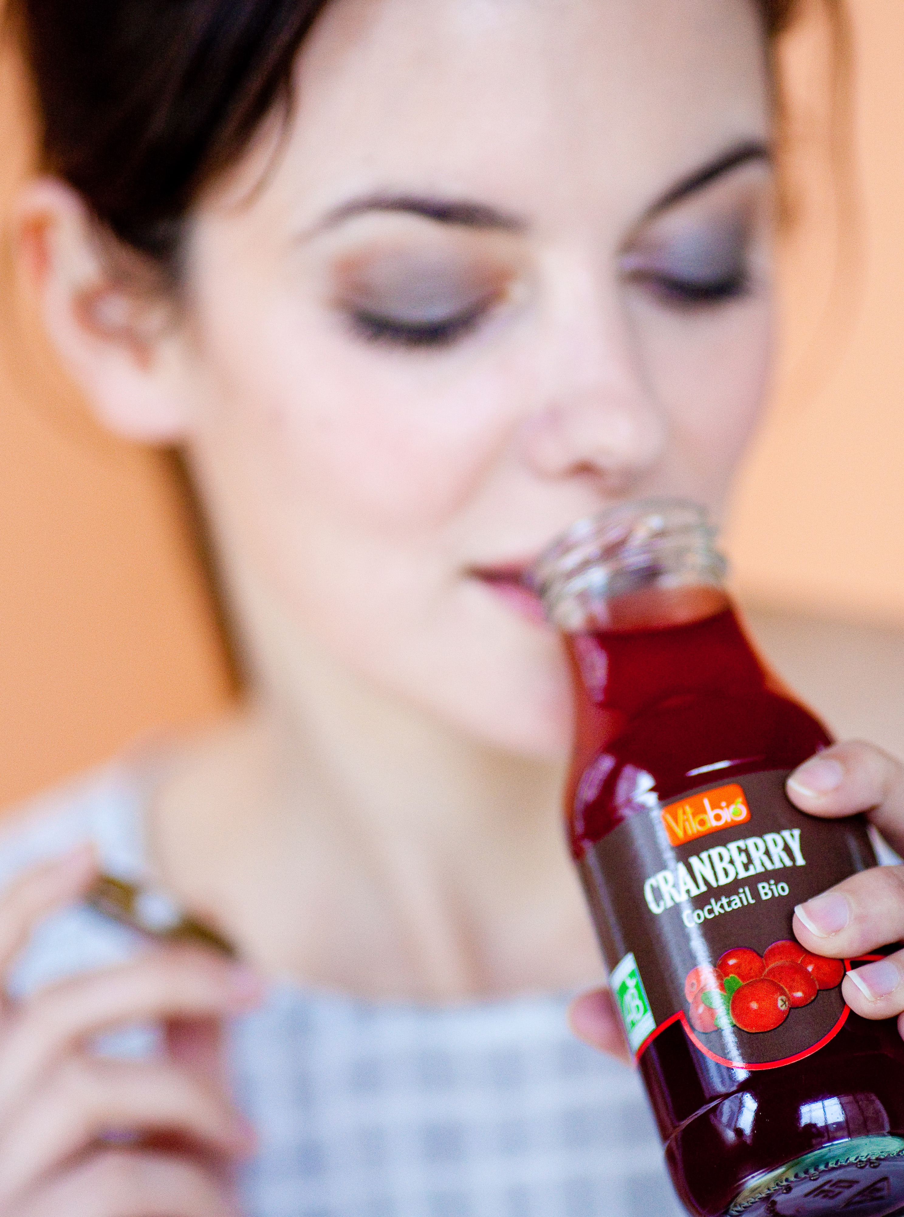 Woman drinking cranberry juice