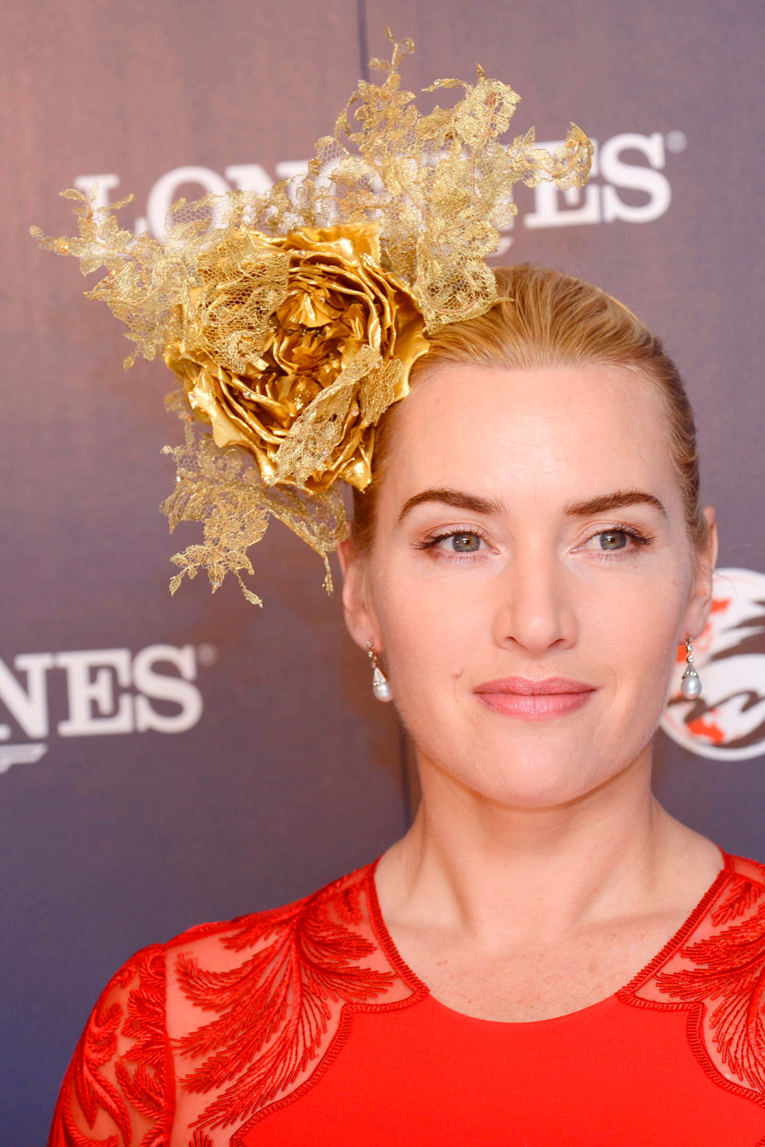 Kate Winslet wearing a red dress and fascinator at the Longines Hong Kong International Races Kate Winslet wearing a red dress and fascinator at the Longines Hong Kong International Races