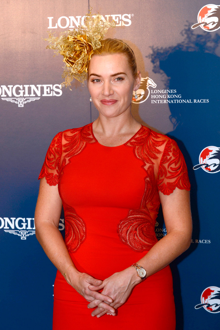 Kate Winslet wearing a red dress and fascinator at the Longines Hong Kong International Races Kate Winslet wearing a red dress and fascinator at the Longines Hong Kong International Races