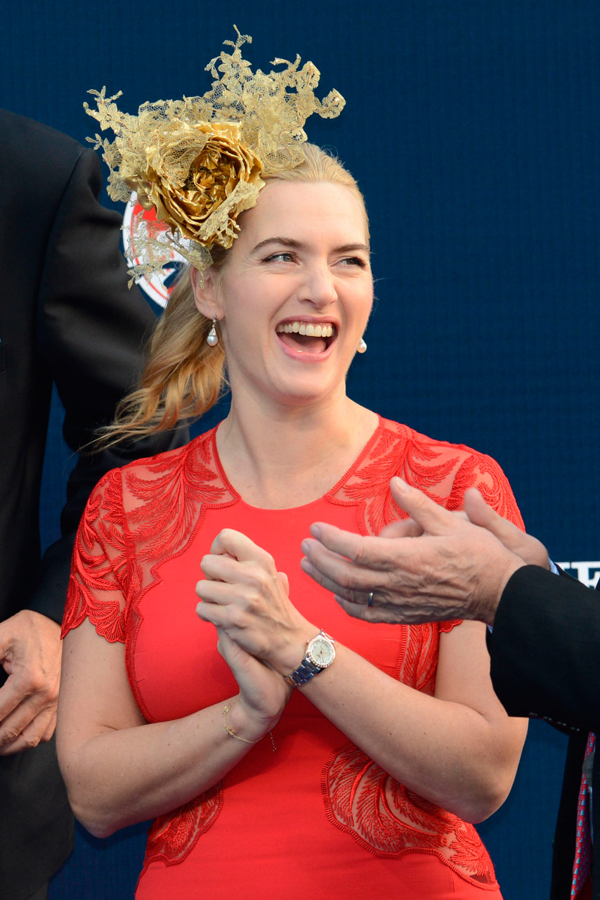 Kate Winslet wearing a red dress and fascinator at the Longines Hong Kong International Races Kate Winslet wearing a red dress and fascinator at the Longines Hong Kong International Races