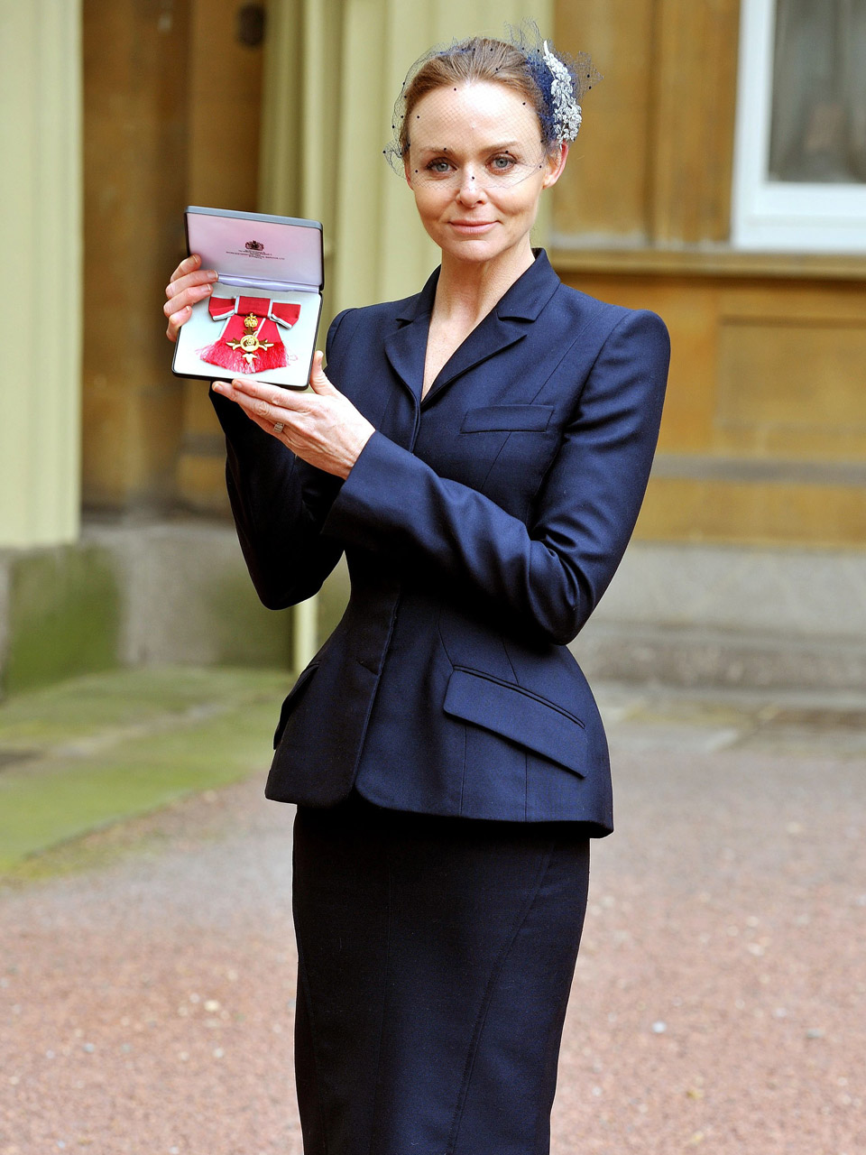Stella McCartney collects her OBE from the Queen