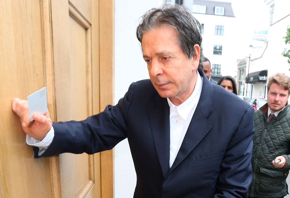 Charles Saatchi arrives at his home after speaking to police
