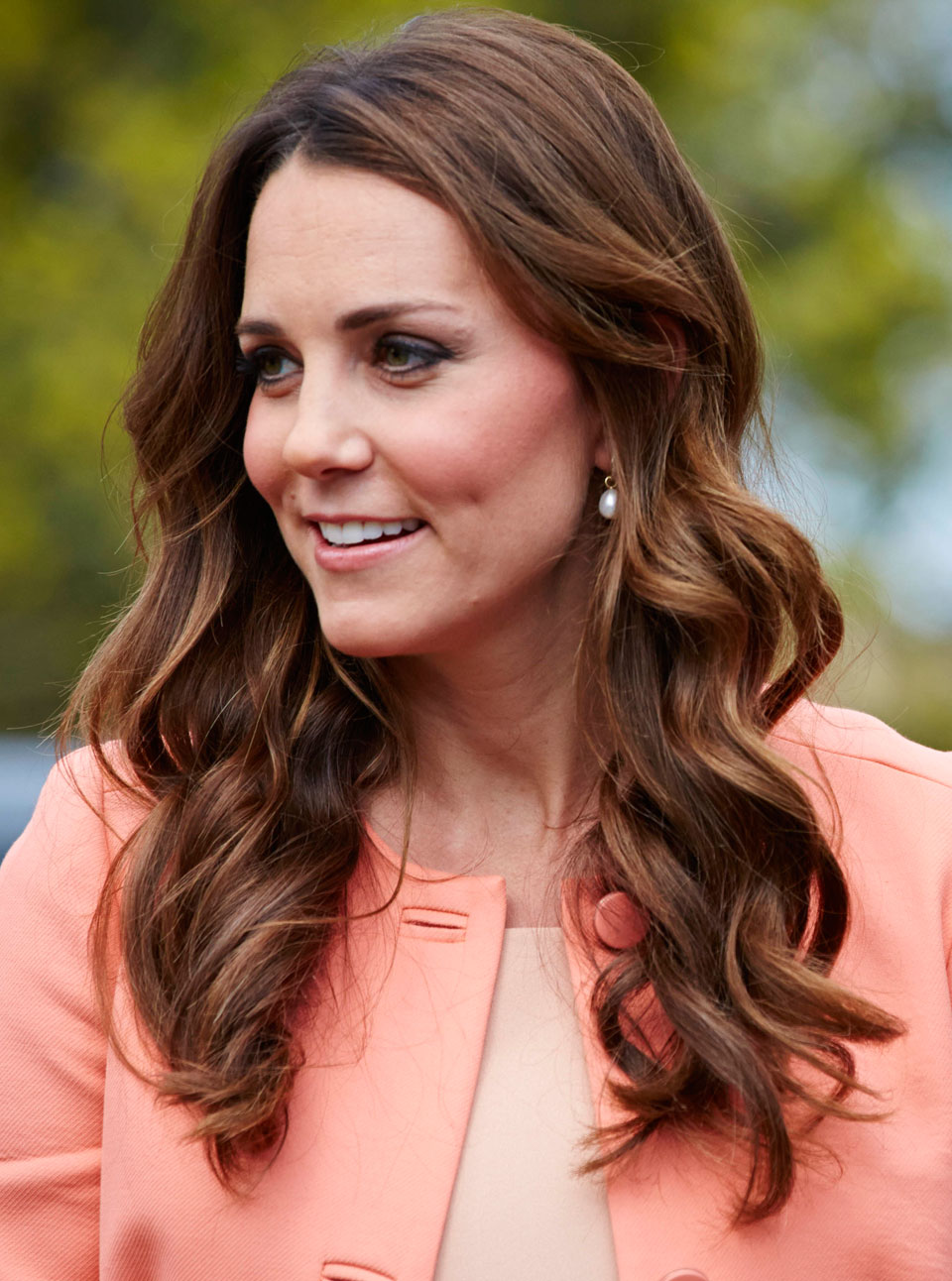 Kate Middleton wearing a peach-coloured coat