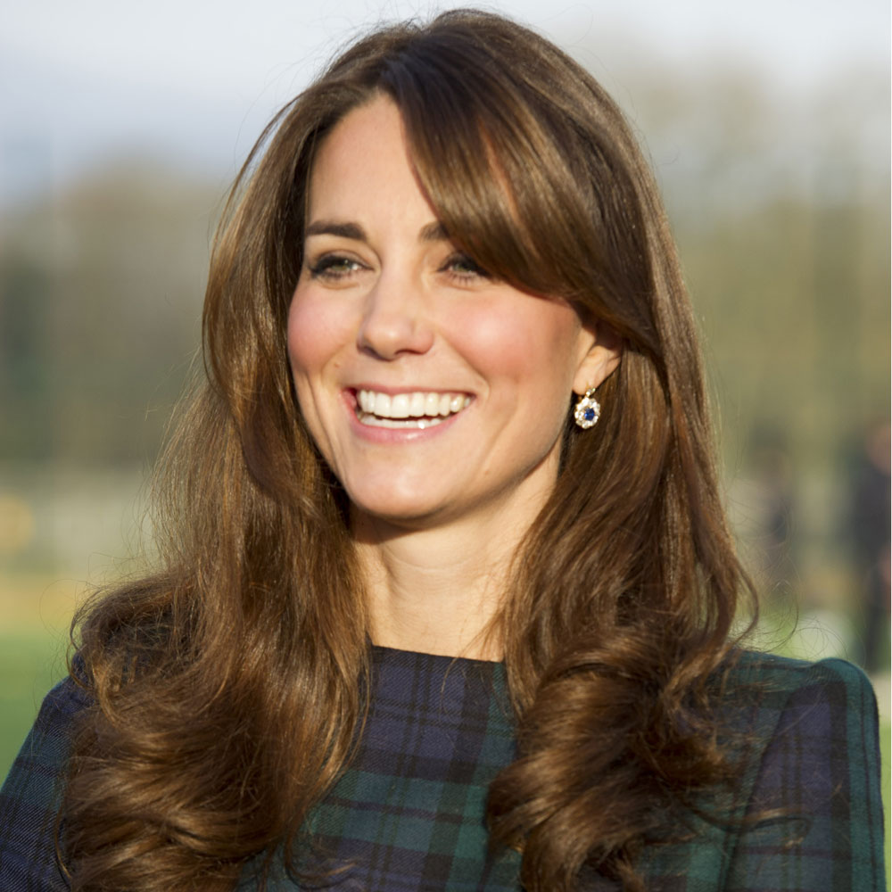 Kate Middleton in a blue and green tartan dress