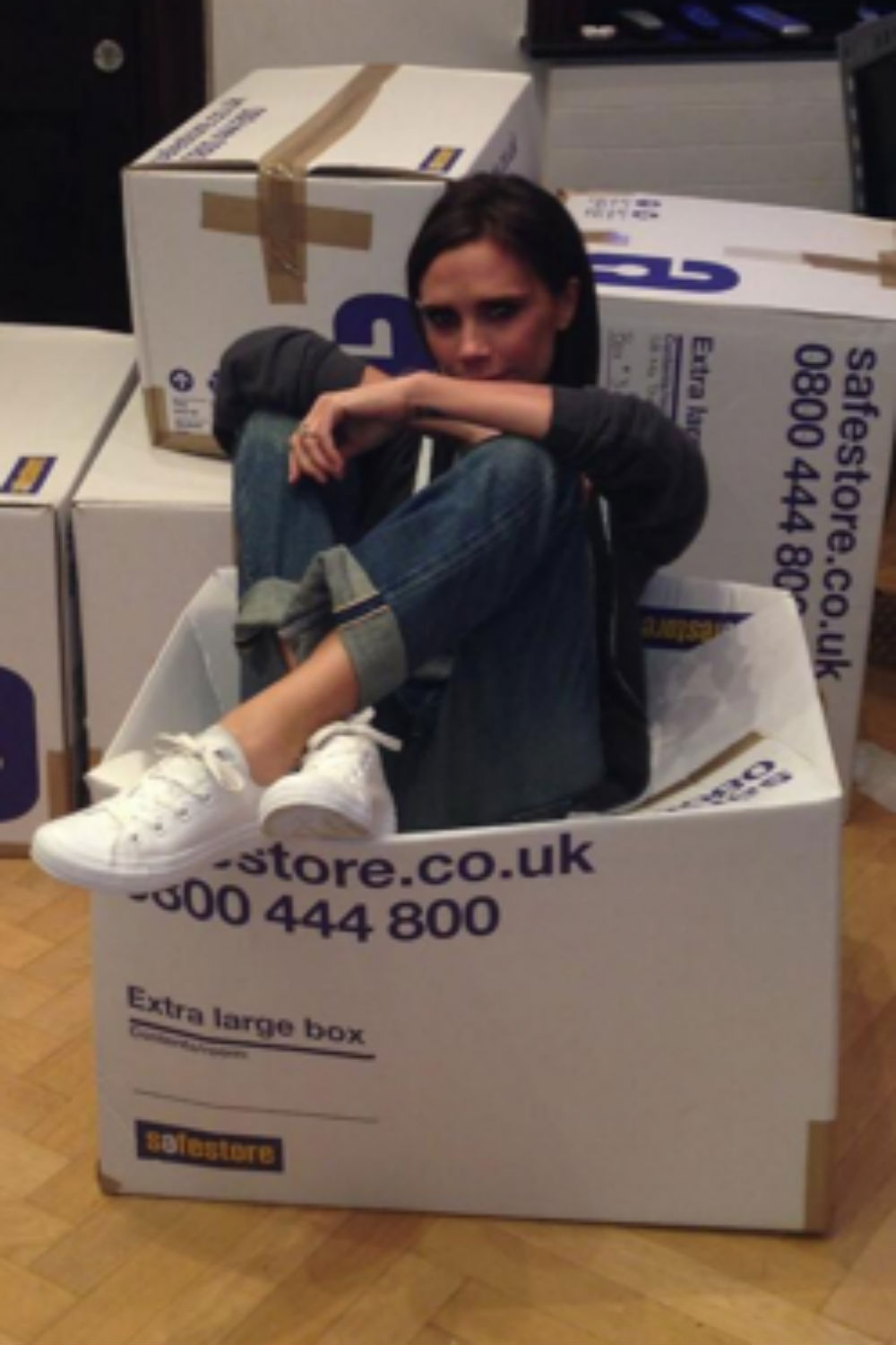 Victoria Beckham gets stuck in while packing clothes for charity Victoria Beckham gets stuck in while packing clothes for charity