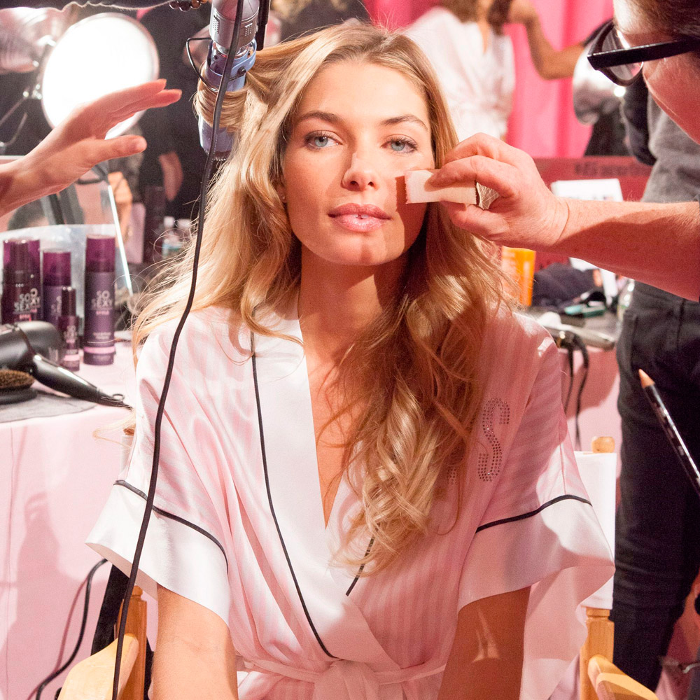 Jessica Hart having under-eye concealers applied at the Victoria's Secret show in 2013