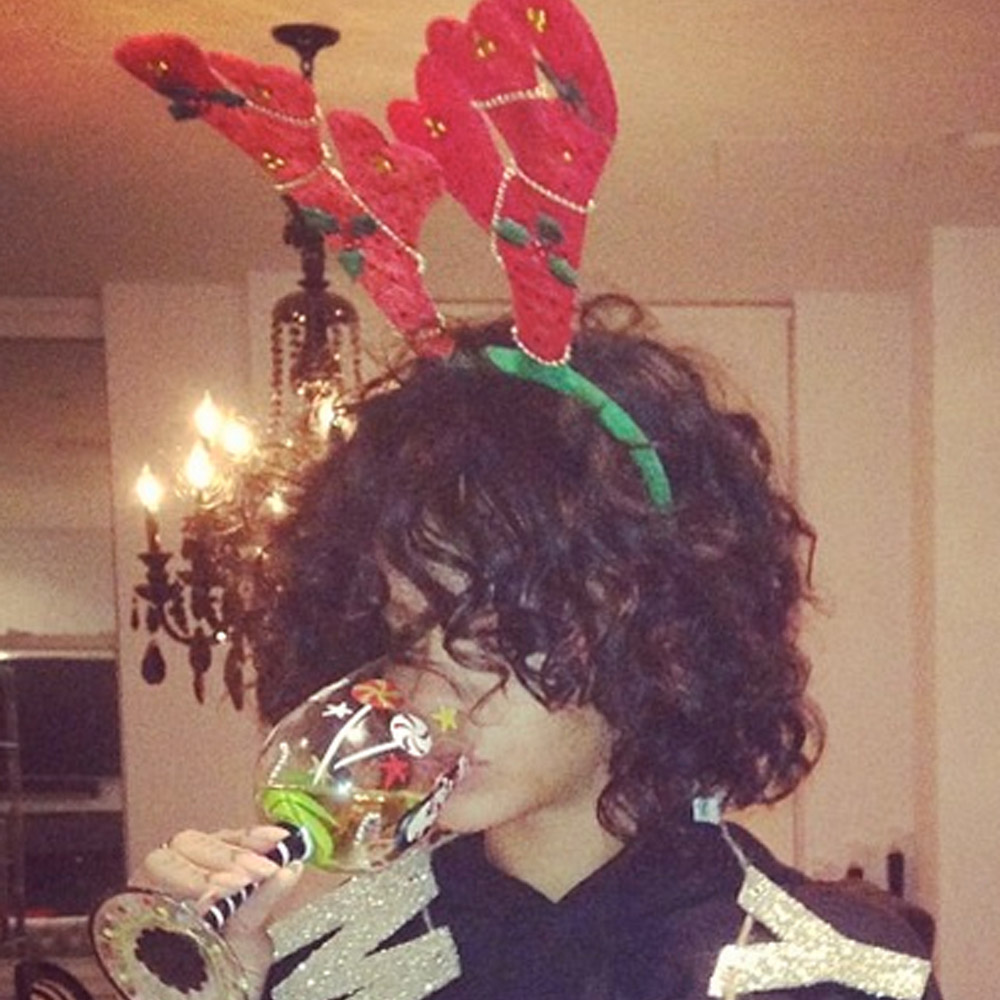 Rihanna wearing a Christmas jumper and antlers 