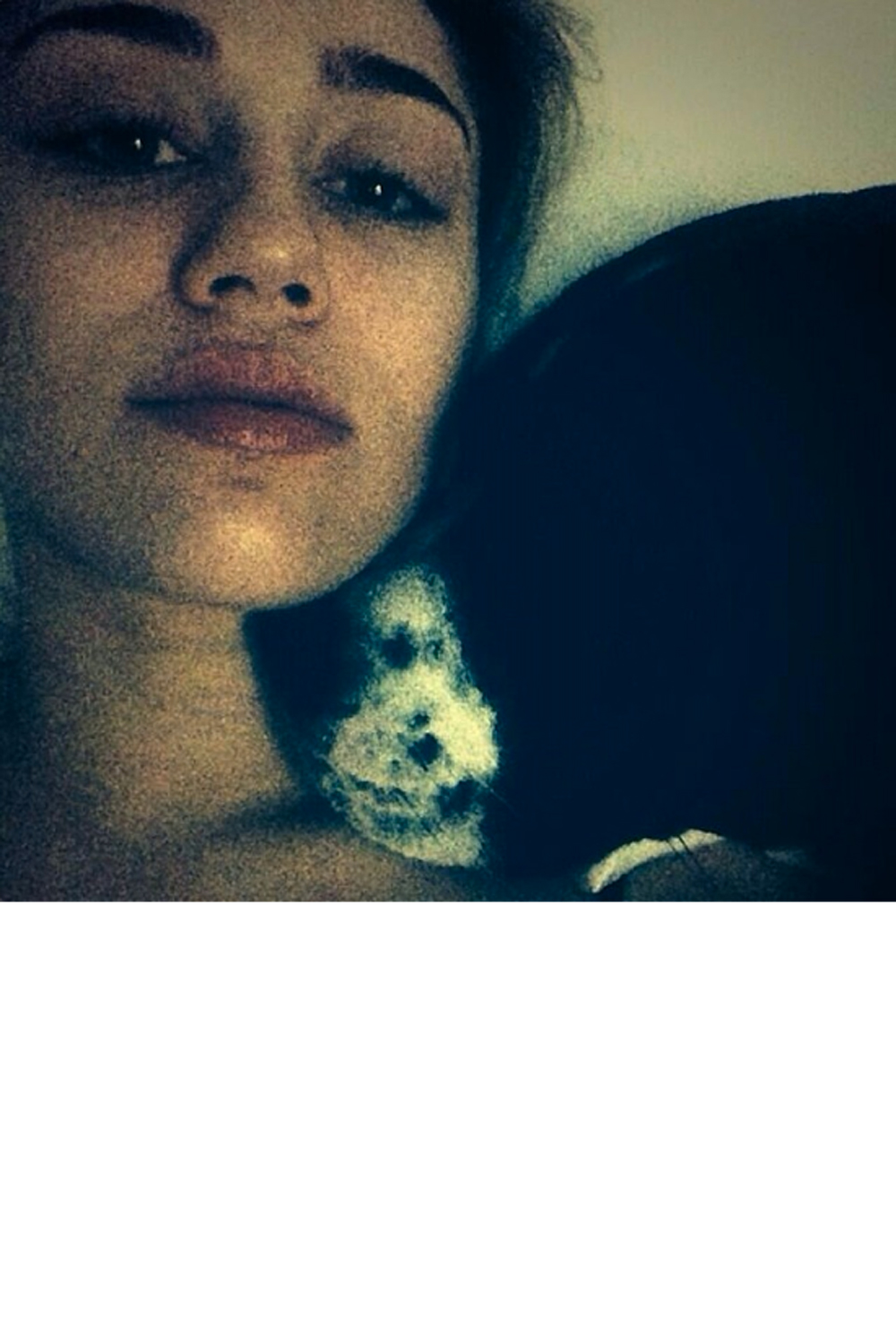 Miley Cyrus cuddling up to her dog Miley Cyrus cuddling up to her dog