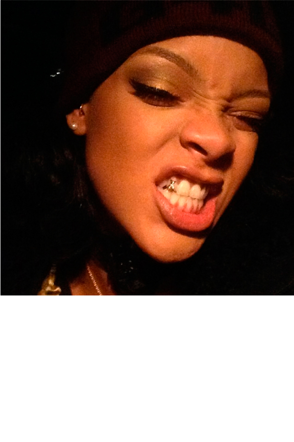 Rihanna showing off her tooth gem Rihanna showing off her tooth gem