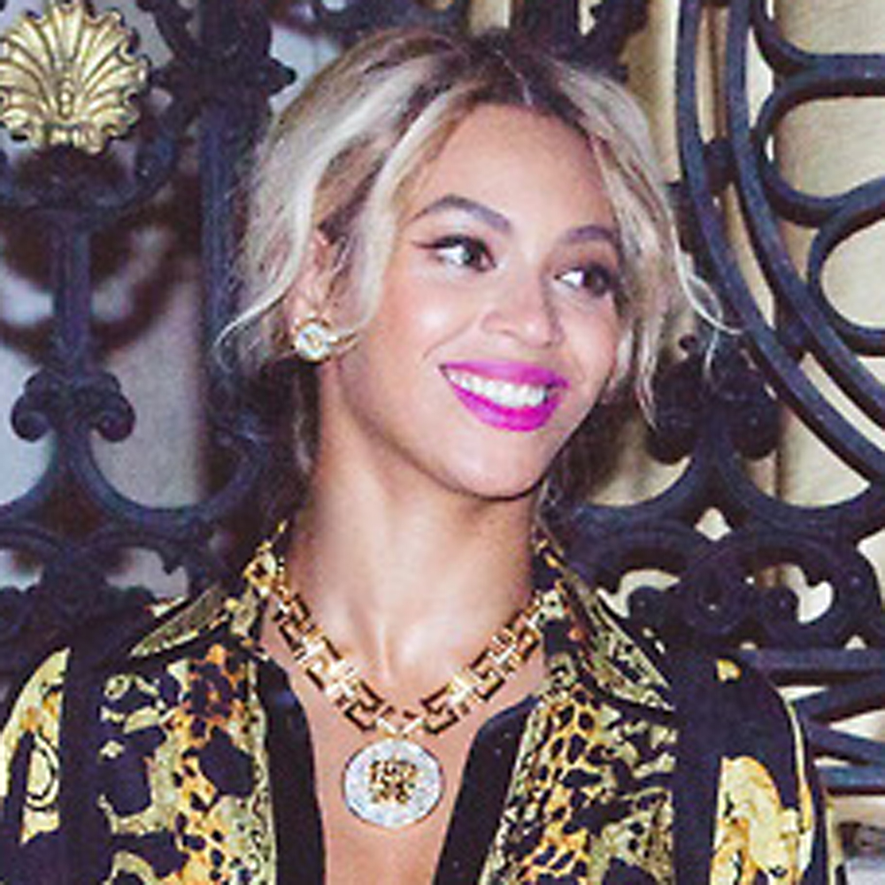Beyonce wears a gold and black dress for her New Year's celebrations