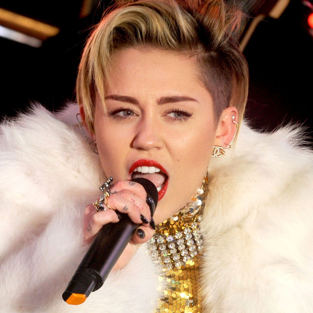 Miley Cyrus performs on stage