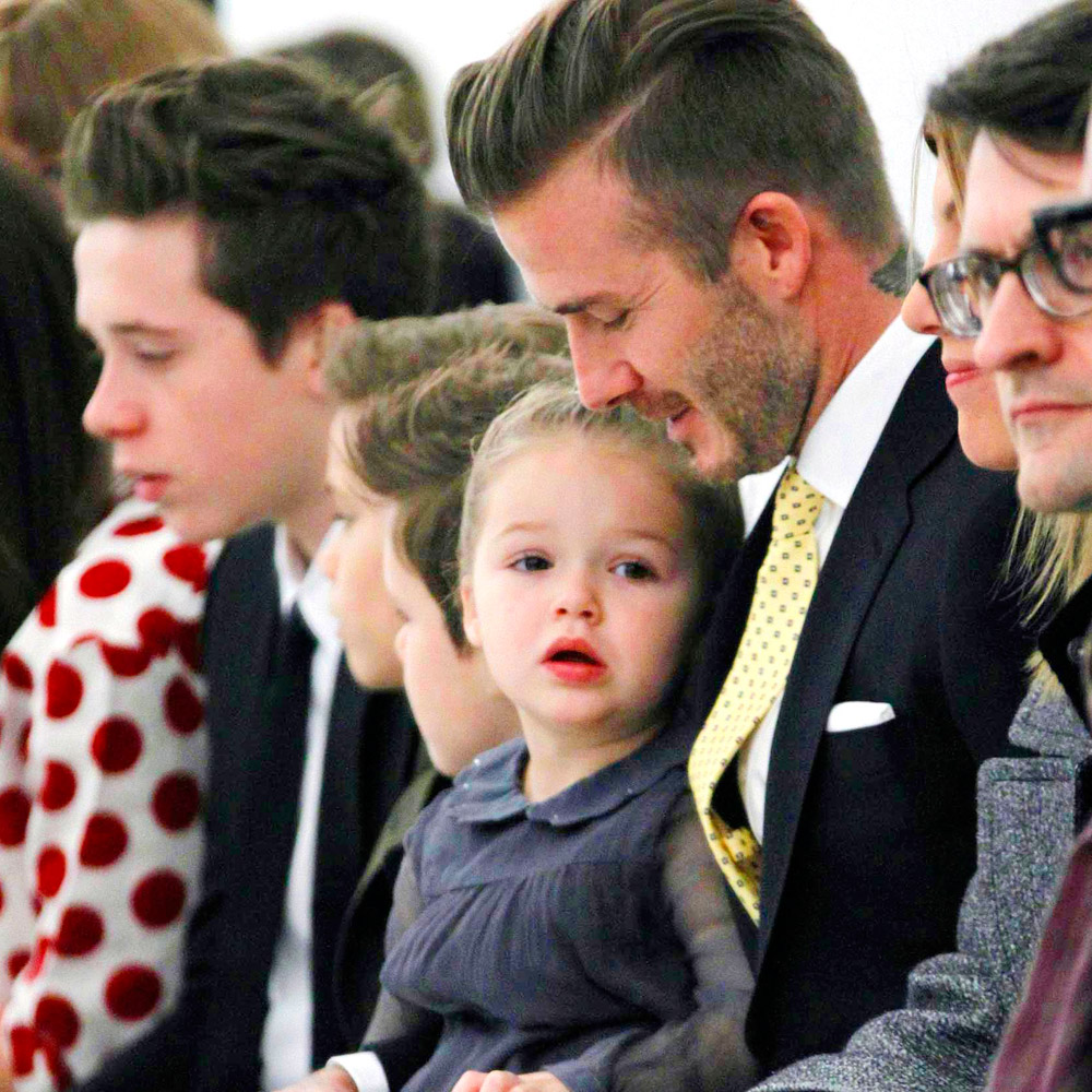 David Beckham with Harper Beckham at Victoria Beckham's AW14 catwalk show