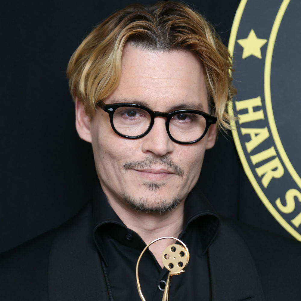 Johnny Depp shows off his blond hair.