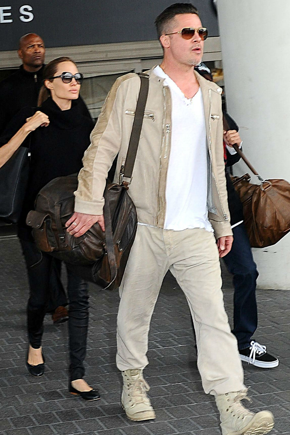 Angelina Jolie, Brad Pitt and Maddox arrive at LAX. Angelina Jolie, Brad Pitt and Maddox arrive at LAX.