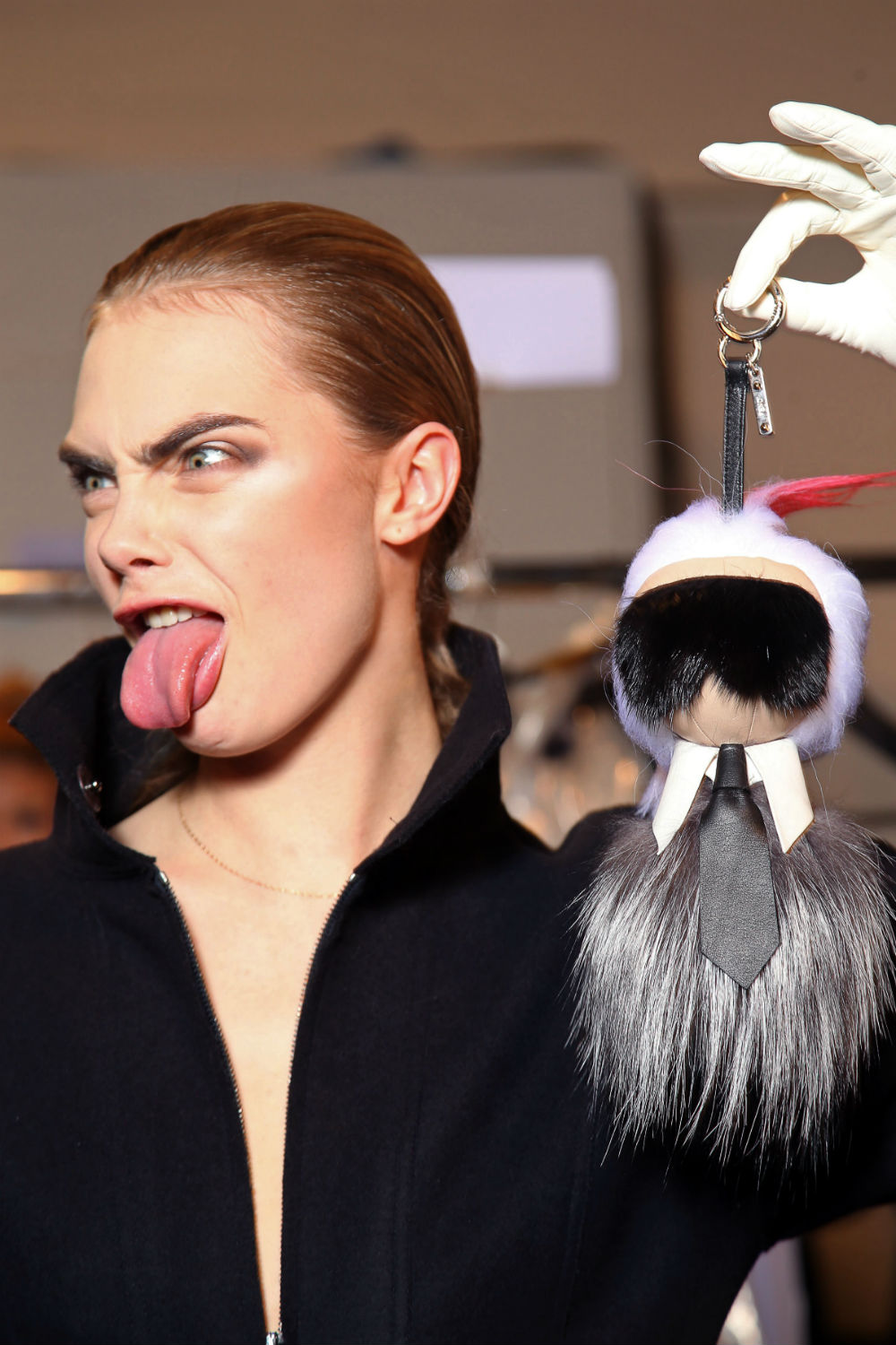 Cara Delevingne carried a Karl Lagerfeld doll in the Fendi show. Cara Delevingne carried a Karl Lagerfeld doll in the Fendi show.