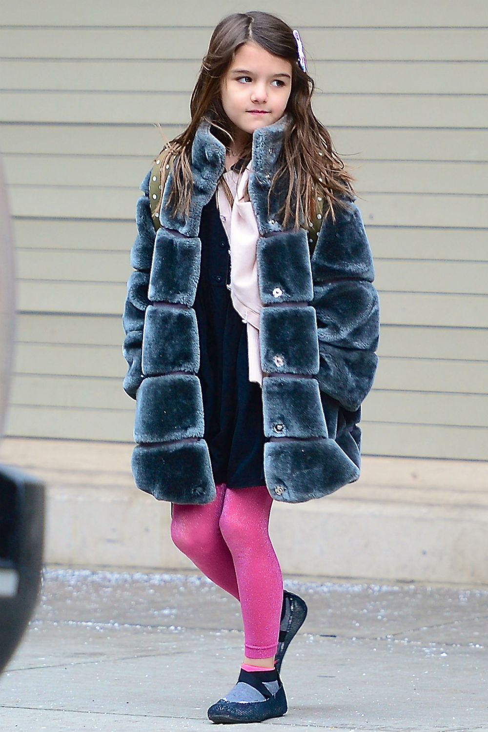 Suri Cruise wears a faux fur coat in New York City. Suri Cruise wears a faux fur coat in New York City.