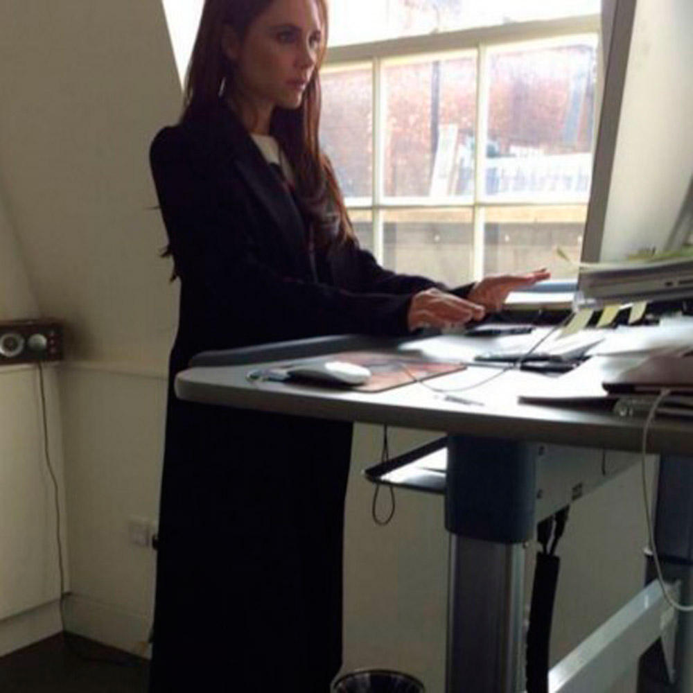 Victoria Beckham at a treadmill desk