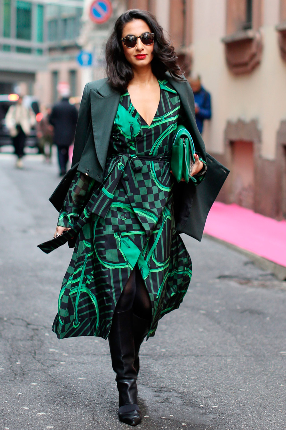 Woman wearing a green and black dress