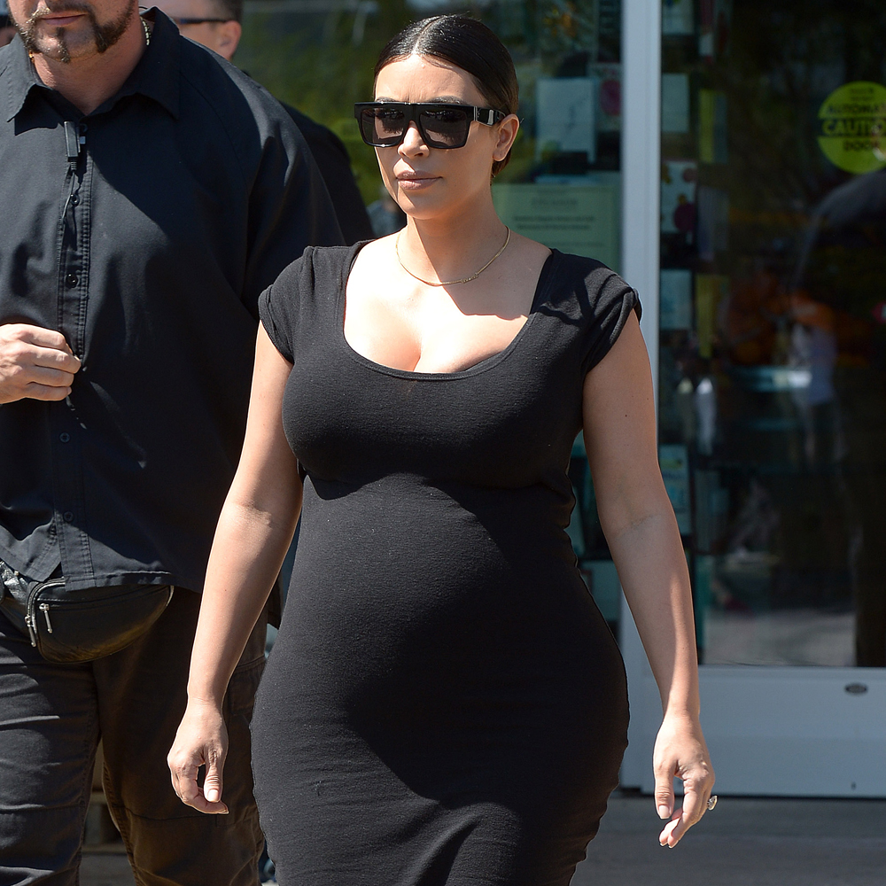 Kim Kardashian pregnant thumb